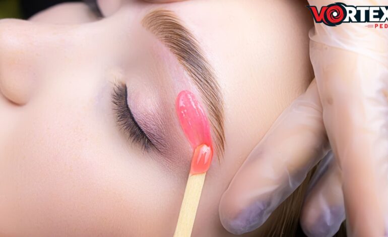 This image shows a women getting brow waxing and tinting services