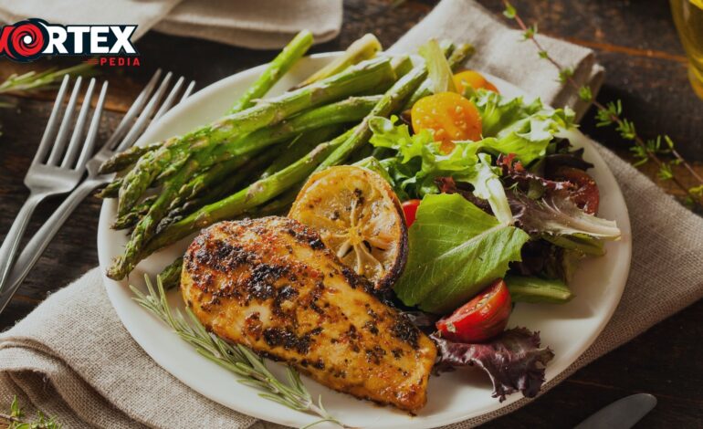 The yummy grilled chicken is lying on the table in white plate.