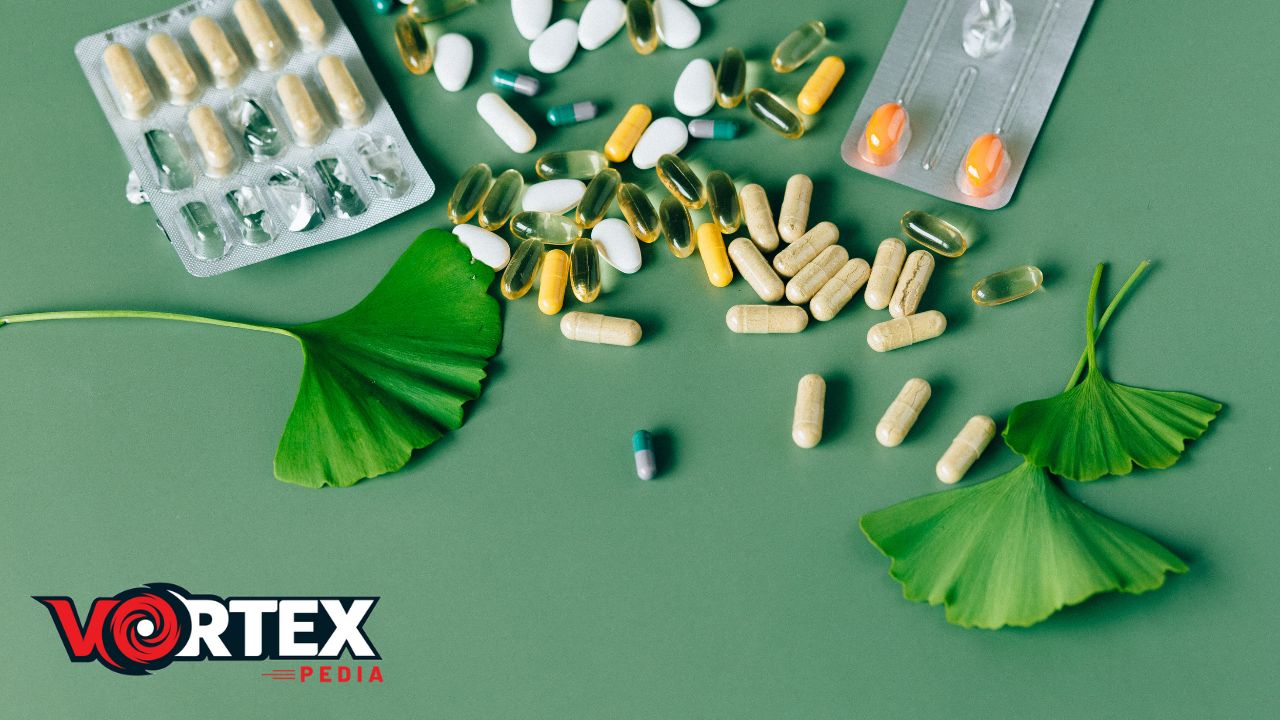 In this image medicines are lying with some leaves with green background.