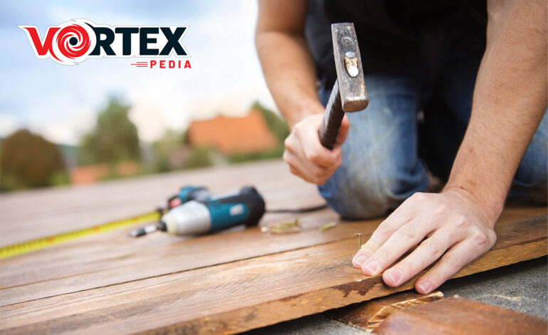 A man is repairing the desk and providing the Best Deck Repair Services