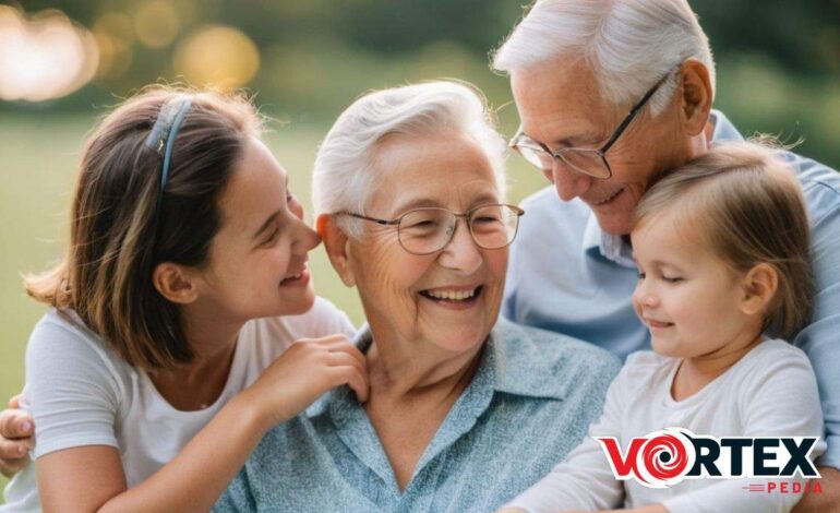 An elderly couple sits outdoors with two young girls, all smiling and sharing a joyful moment together.