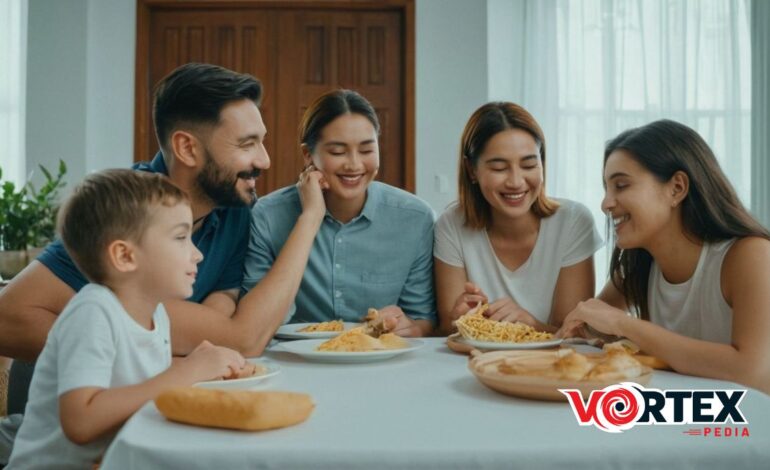 A family of five sitting at a table eating a meal together.