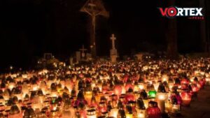 The group of candles in a cemetery and celebrating All Saints’ Day.