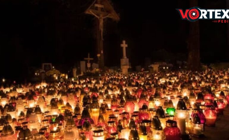 The group of candles in a cemetery and celebrating All Saints’ Day.